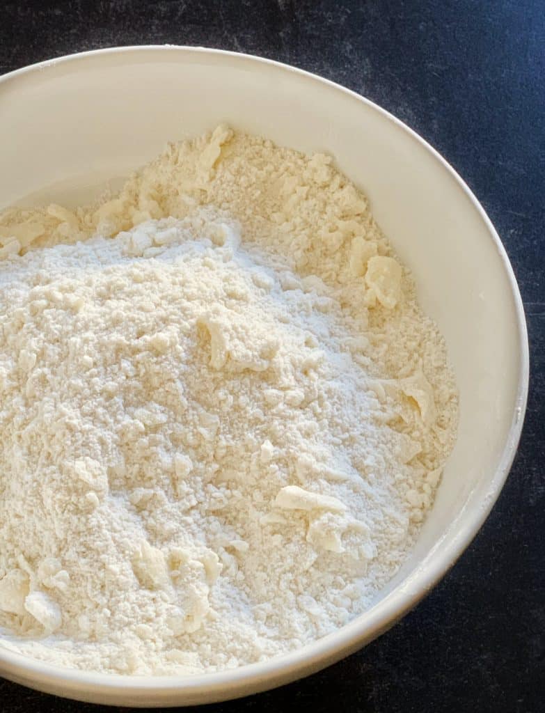 combined butter and flour in a bowl for gluten free pastry dough