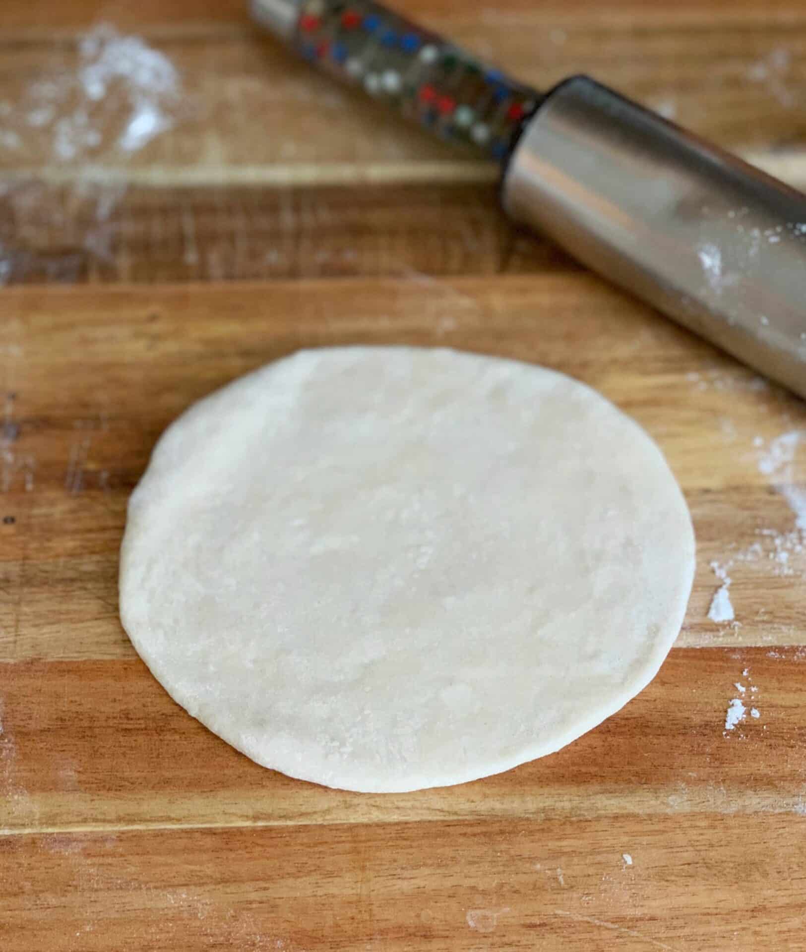 A flat dough ball ready for frying