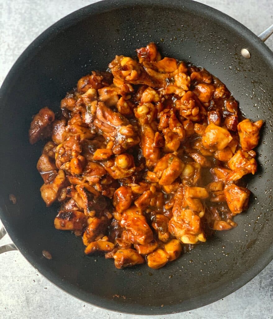 brown stew chicken in a wok