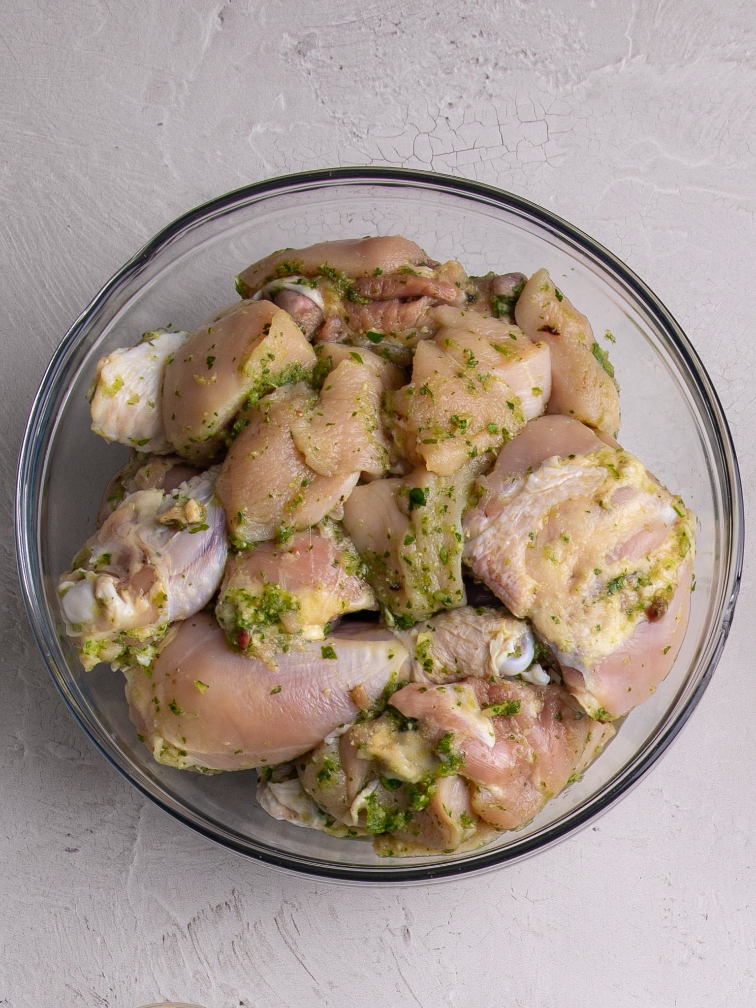 A whole cut up chicken with seasoning