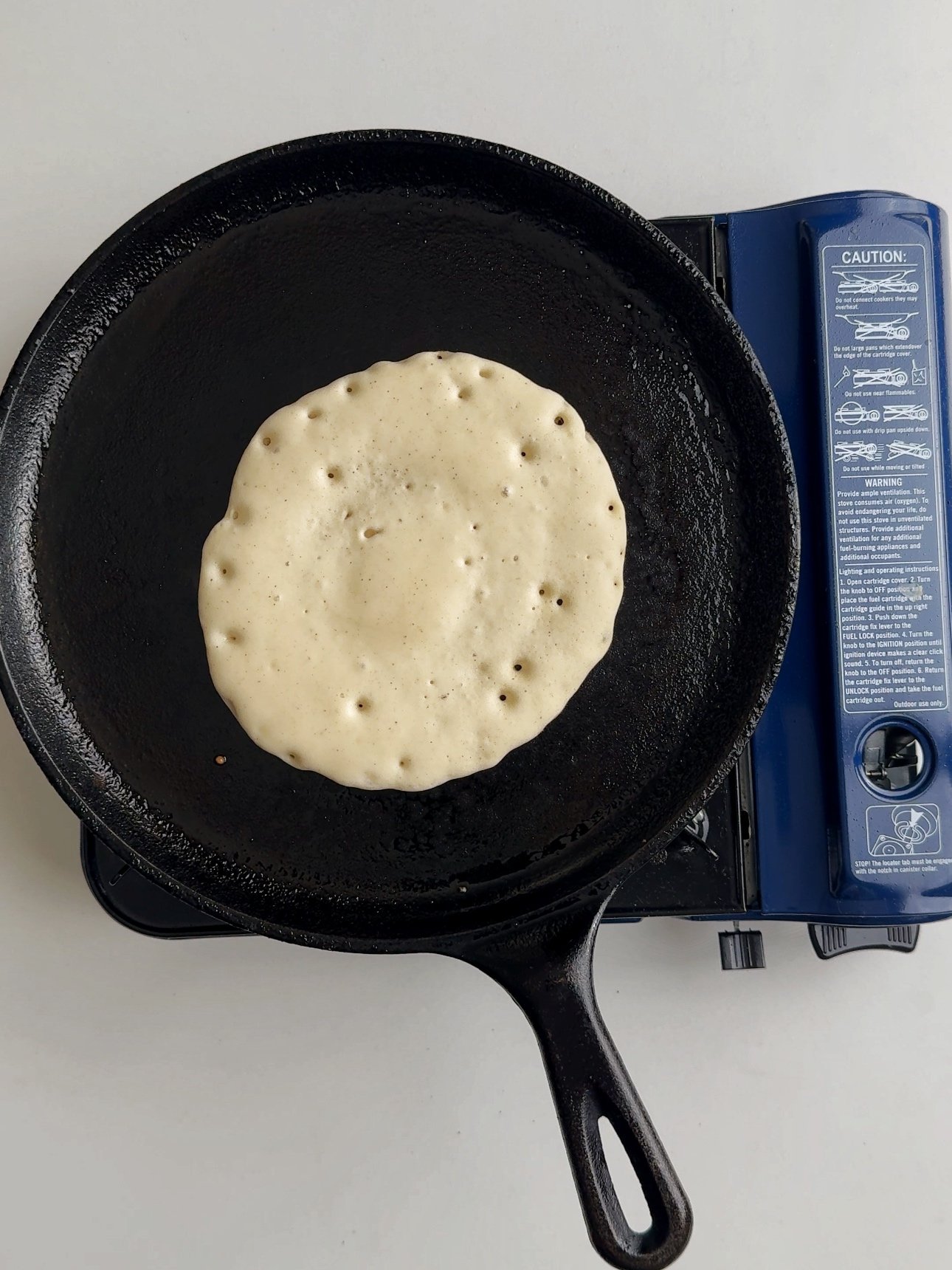 Cooked chota on the Tawa showing the top when it is ready to flip. 