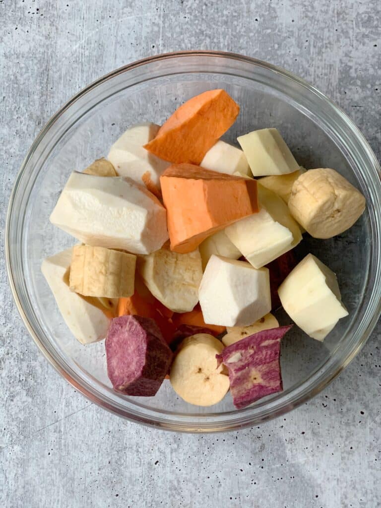 Glass bowl filled with root vegetables