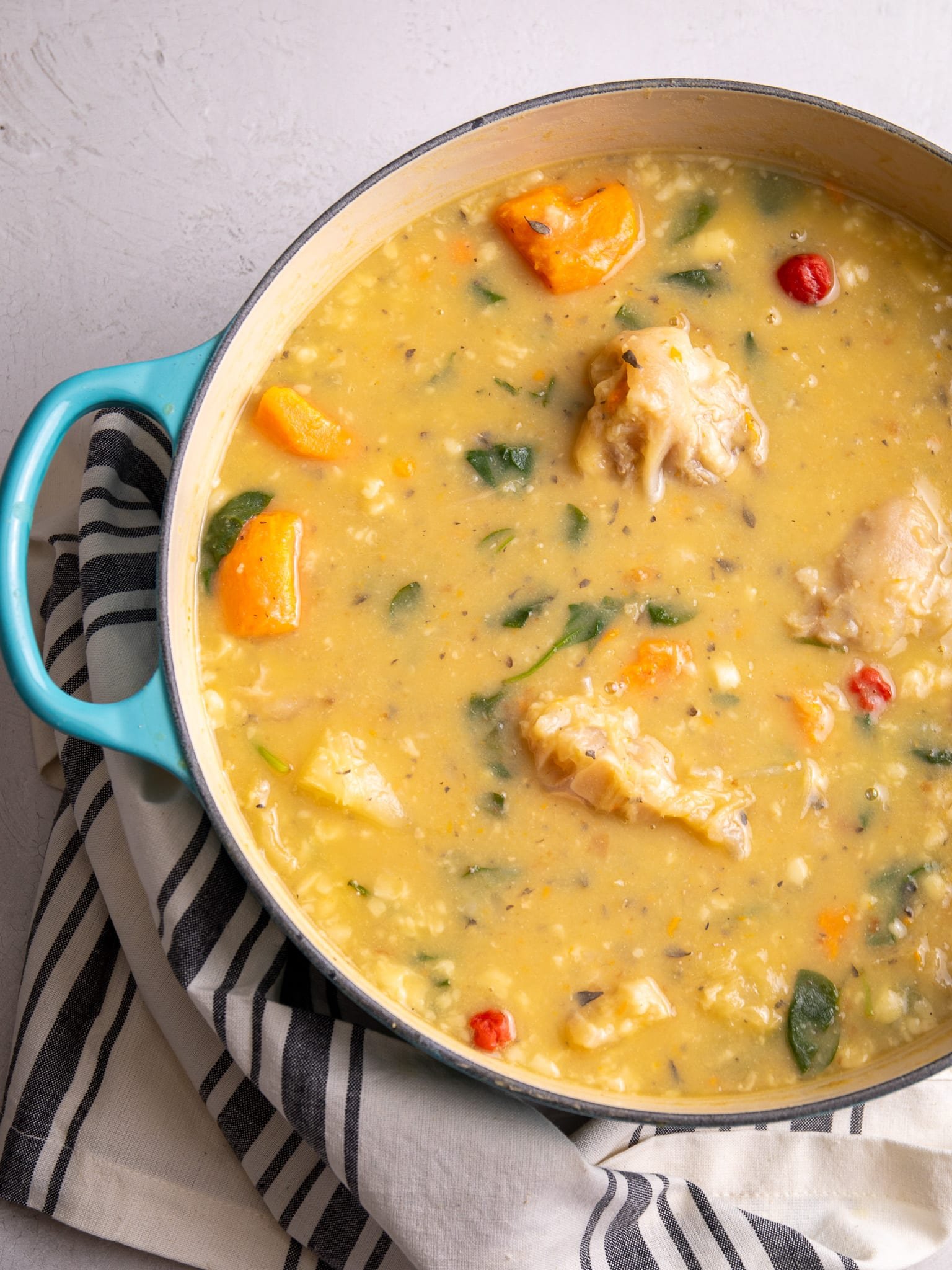 A half view of a pot of cow heel soup.