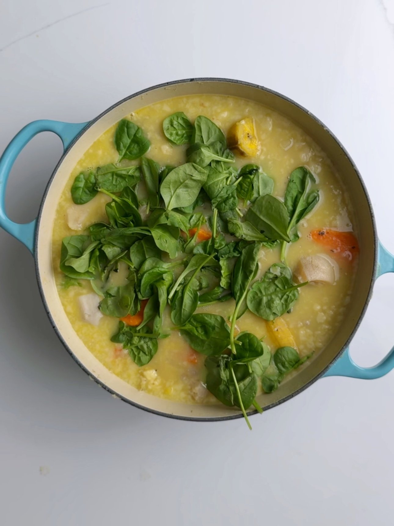 Adding spinach to cow heel soup