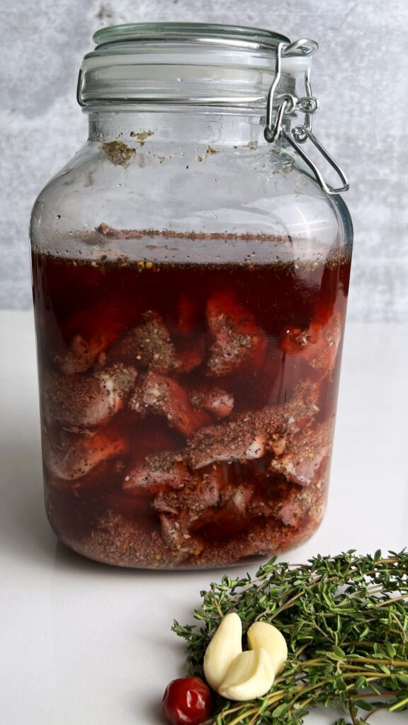 mason jar with Garlic Pork Pickling in Red Wine Vinegar