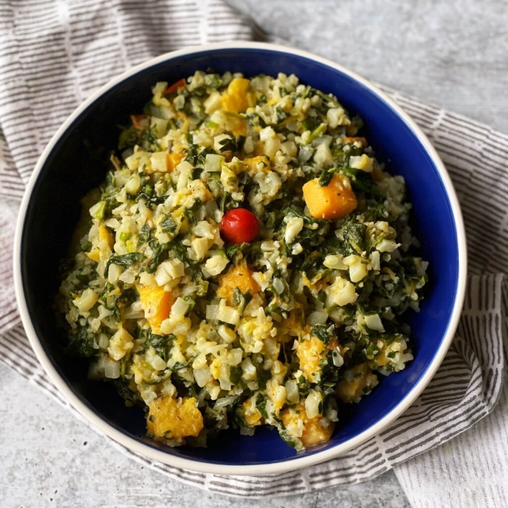 callaloo cauliflower cook up rice in blue bowl