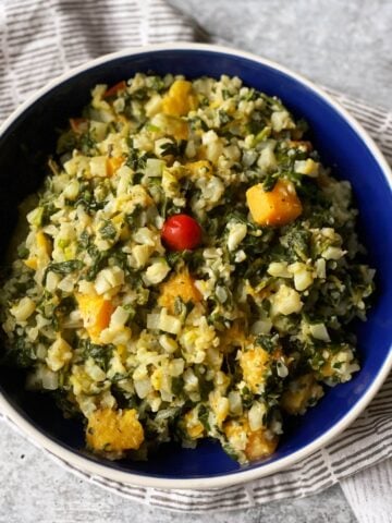 callaloo cook up rice in blue bowl