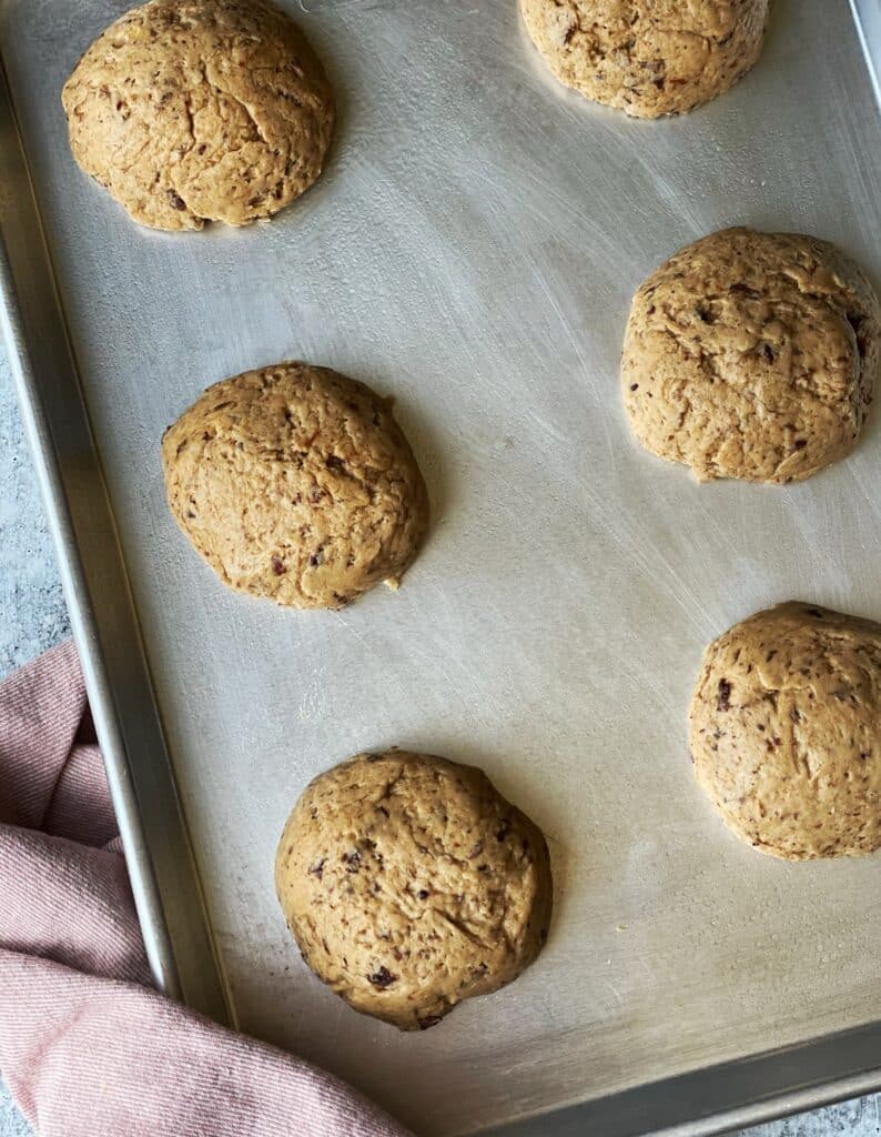 gluten free hot cross buns on a baking sheet