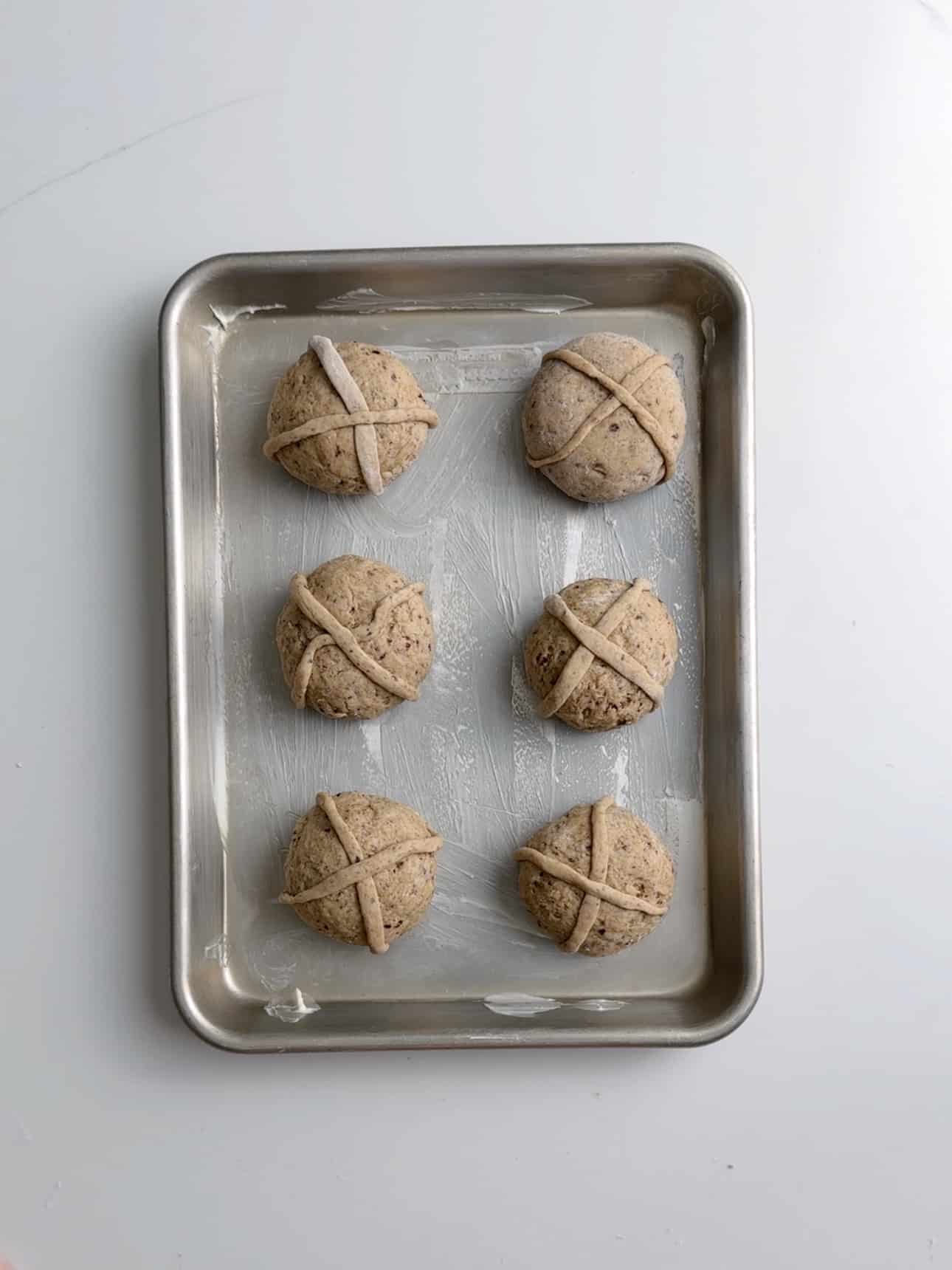 A tray of gluten free hot cross buns