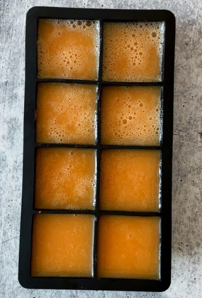 juice poured into an ice cube tray