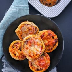 5 gluten free pinwheels stacked on each other in a black plate