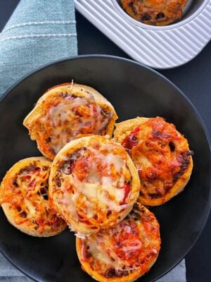 5 gluten free pinwheels stacked on each other in a black plate