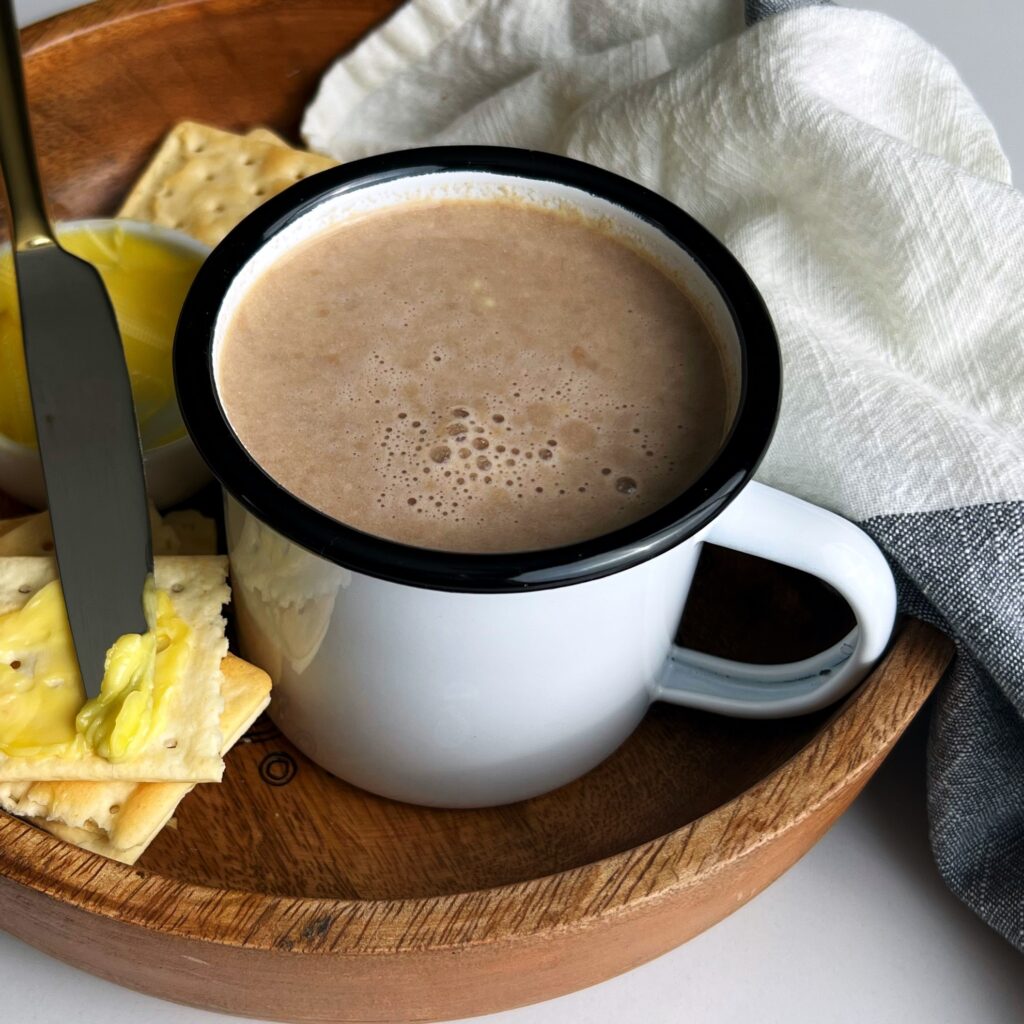 cocoa tea in a white enamel cup