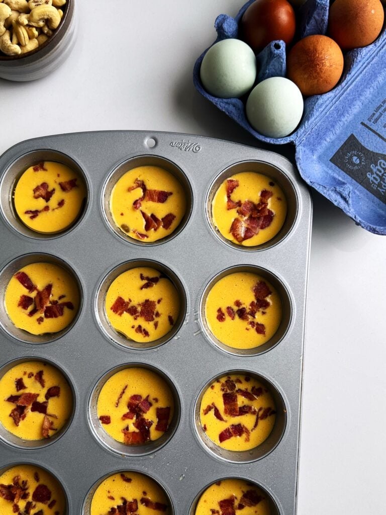 egg bites before cooking in a baking pan