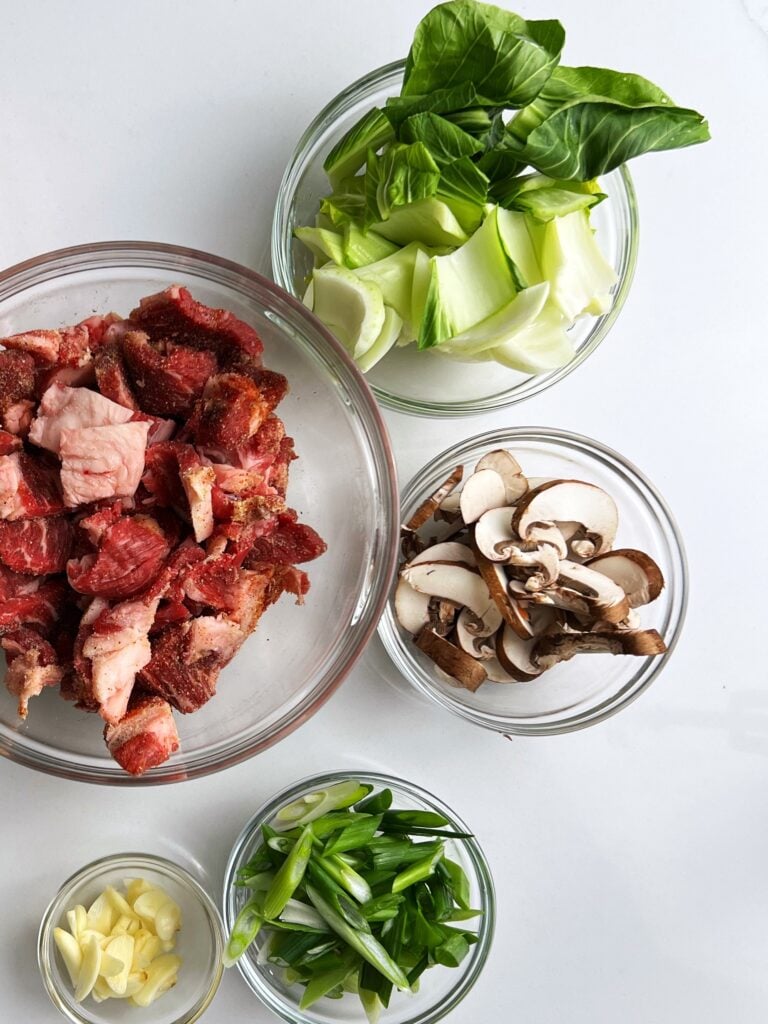 steak and veggies in glass bowls