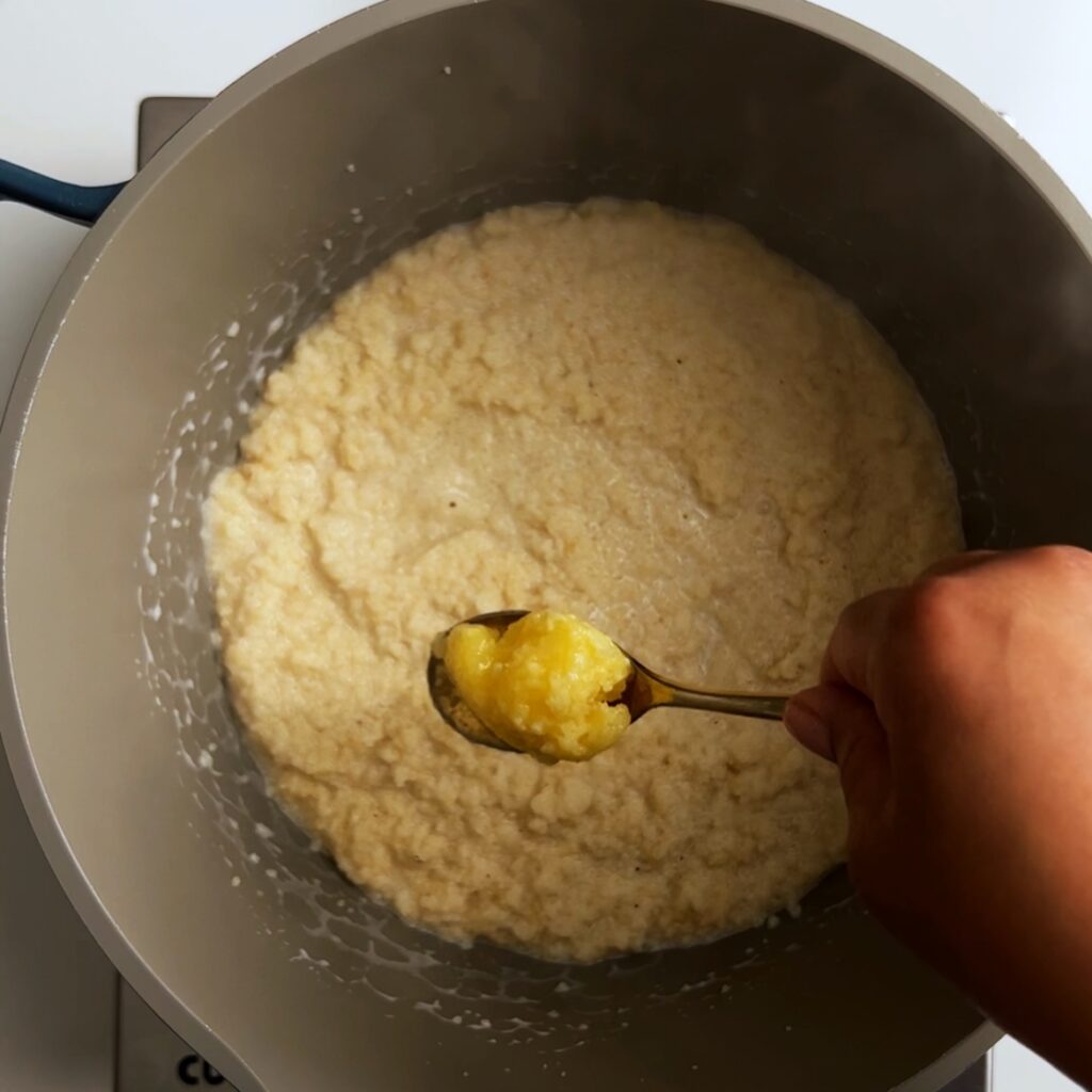 Topping the cassava grits off with ghee