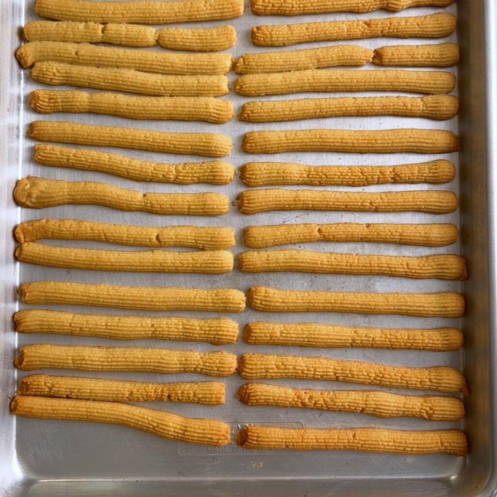 Baked cheese straws stacked
