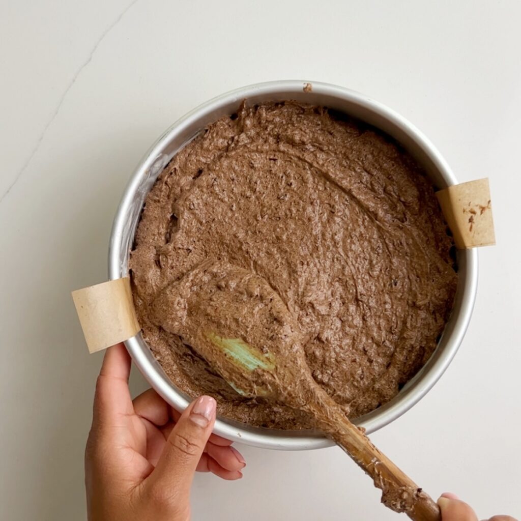 non-alcoholic black cake batter added to greased baking pan