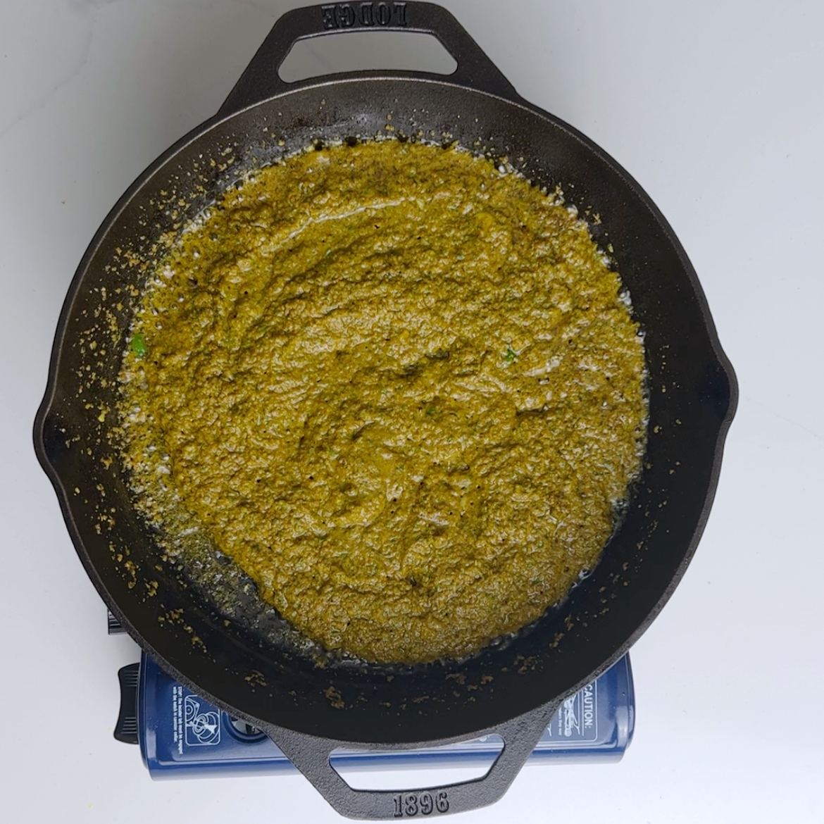 overhead view of a skillet full of curry sauce