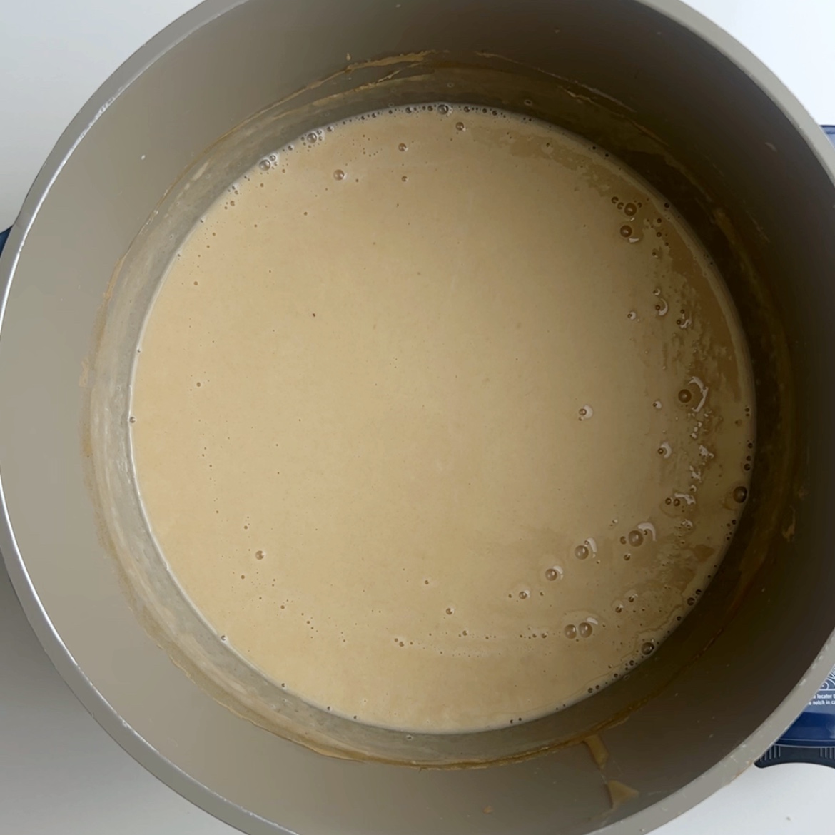Flour porridge boiling in a pot