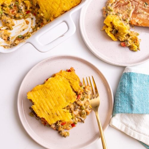 Plated plantain shepherd's pie next to a casserole dish containing more