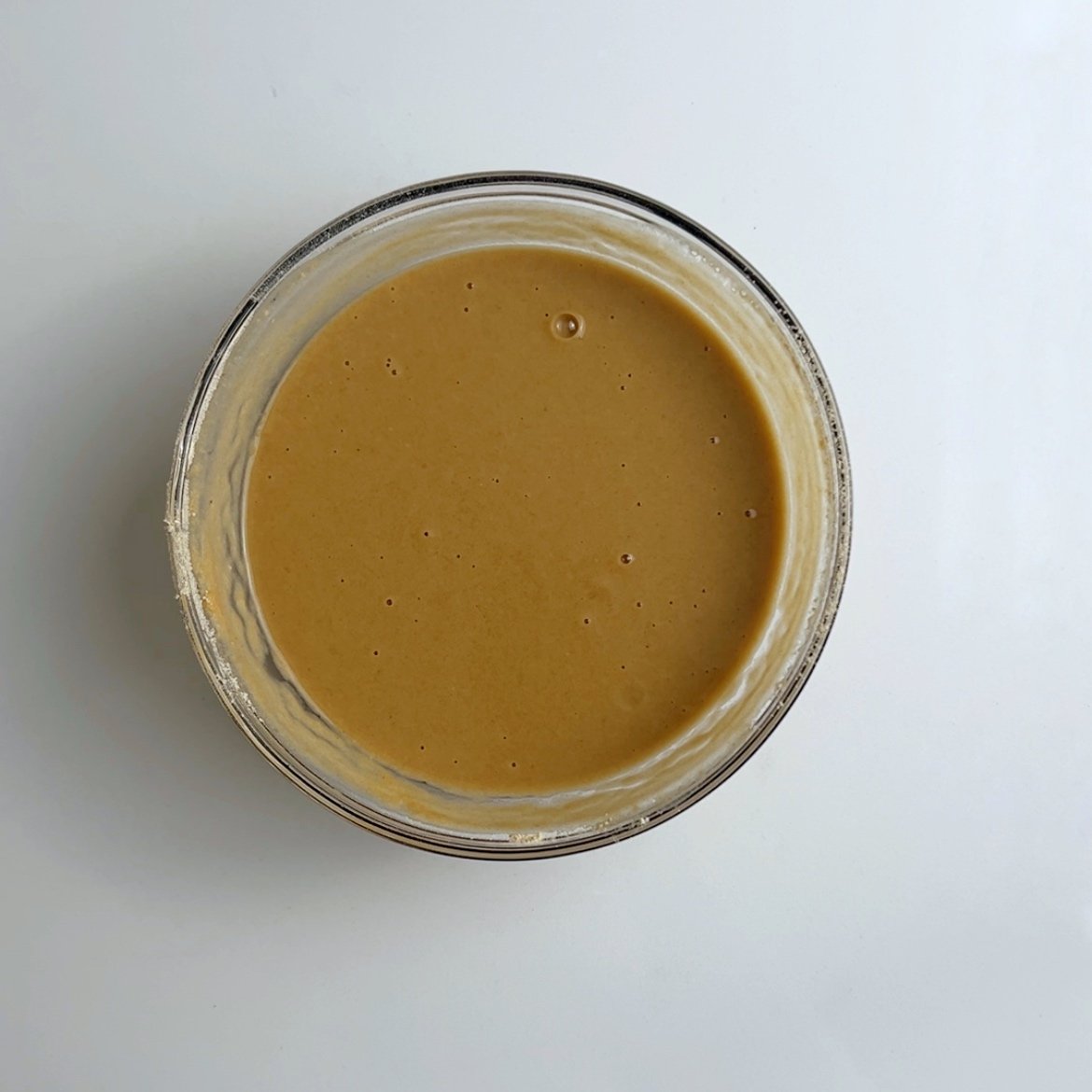 Water and toasted flour mixed together in a glass bowl