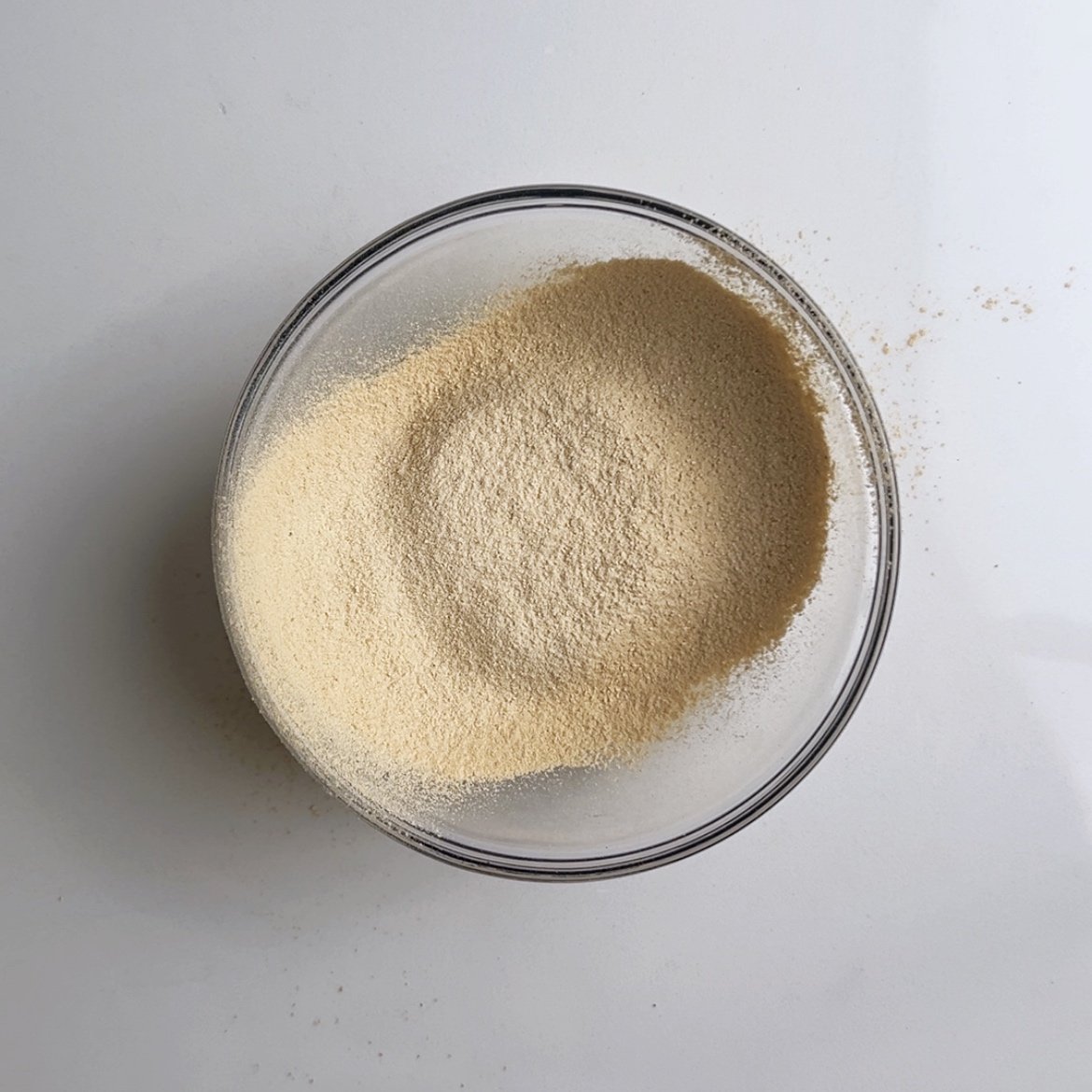 Sifted flour in a glass bowl