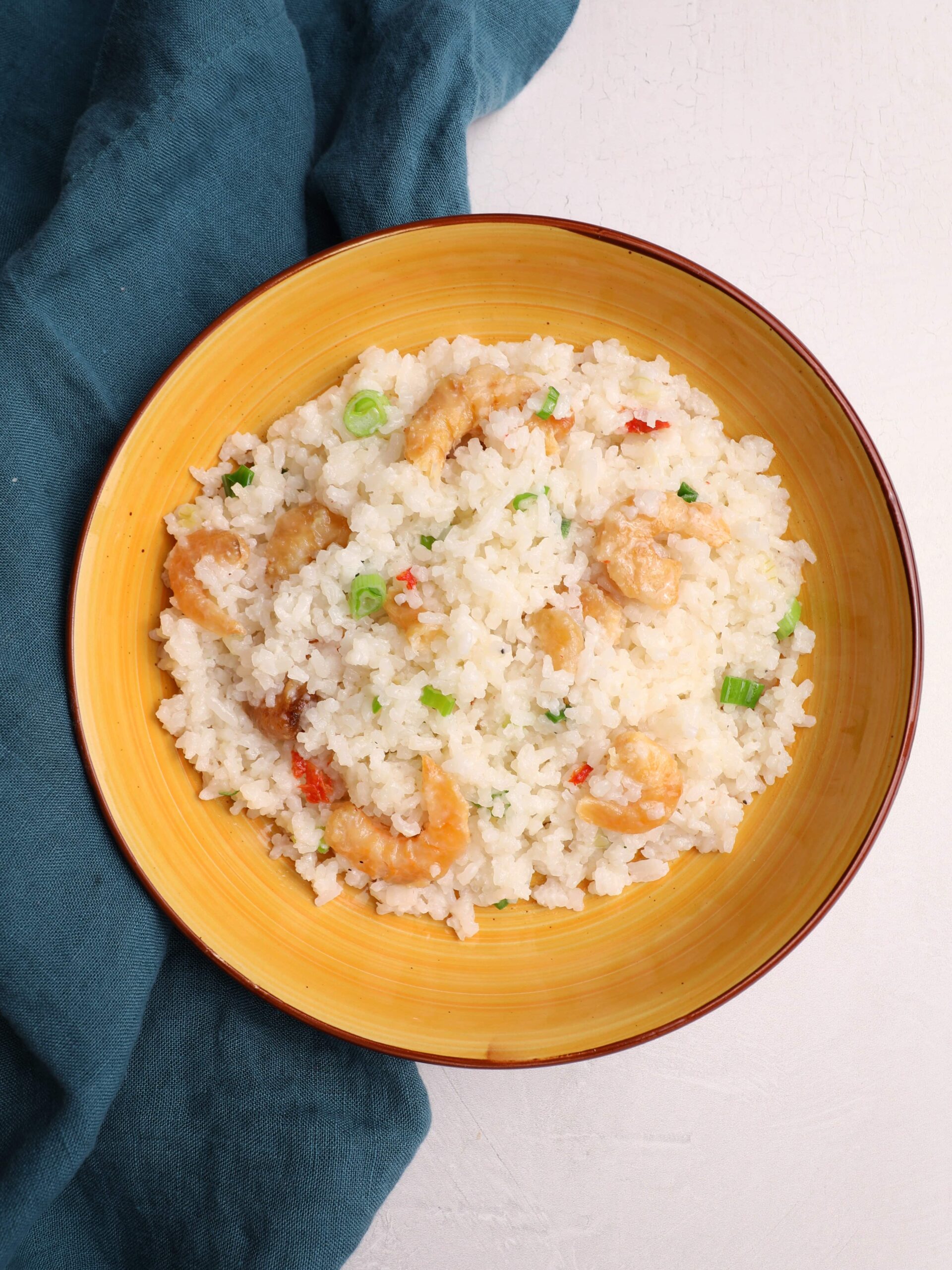 Guyanese shine rice with shrimp in a yellow bowl