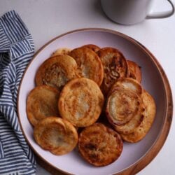 A plate filled with soft bakes and a cup of coffee