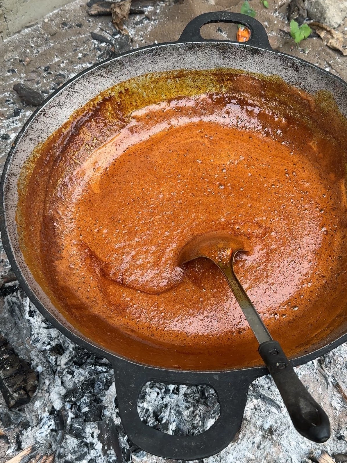 Frothy cassava extract boiling in a pot