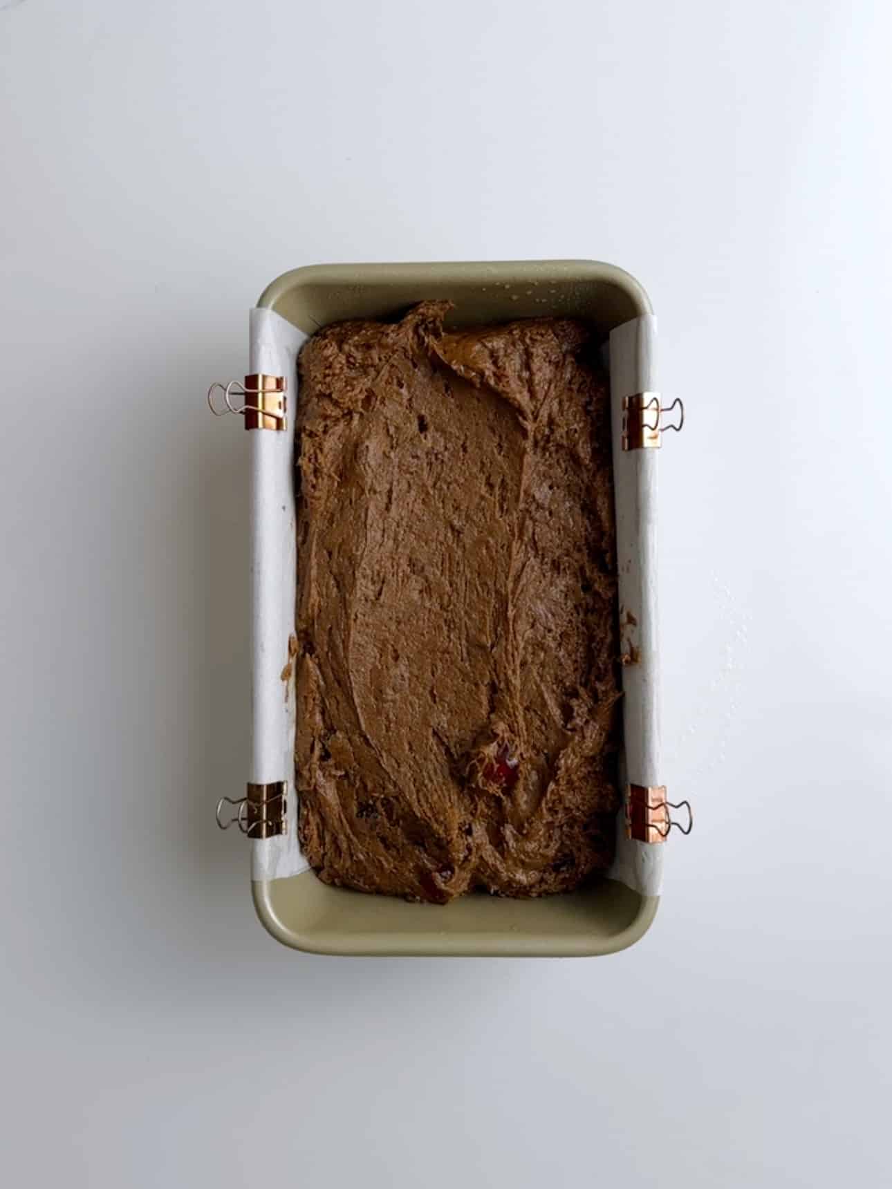 Jamaican Easter bun batter poured into a loaf pan.