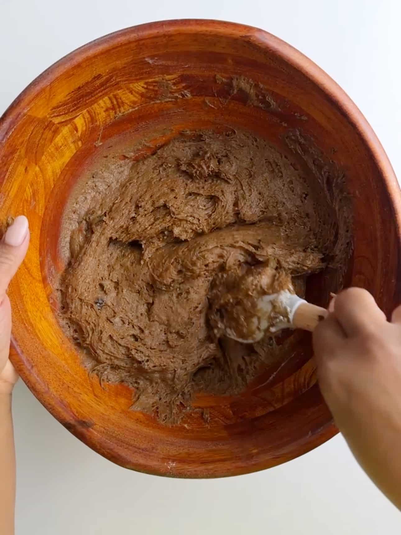 Thick batter for Jamaican Easter bun being mixed in a bowl.