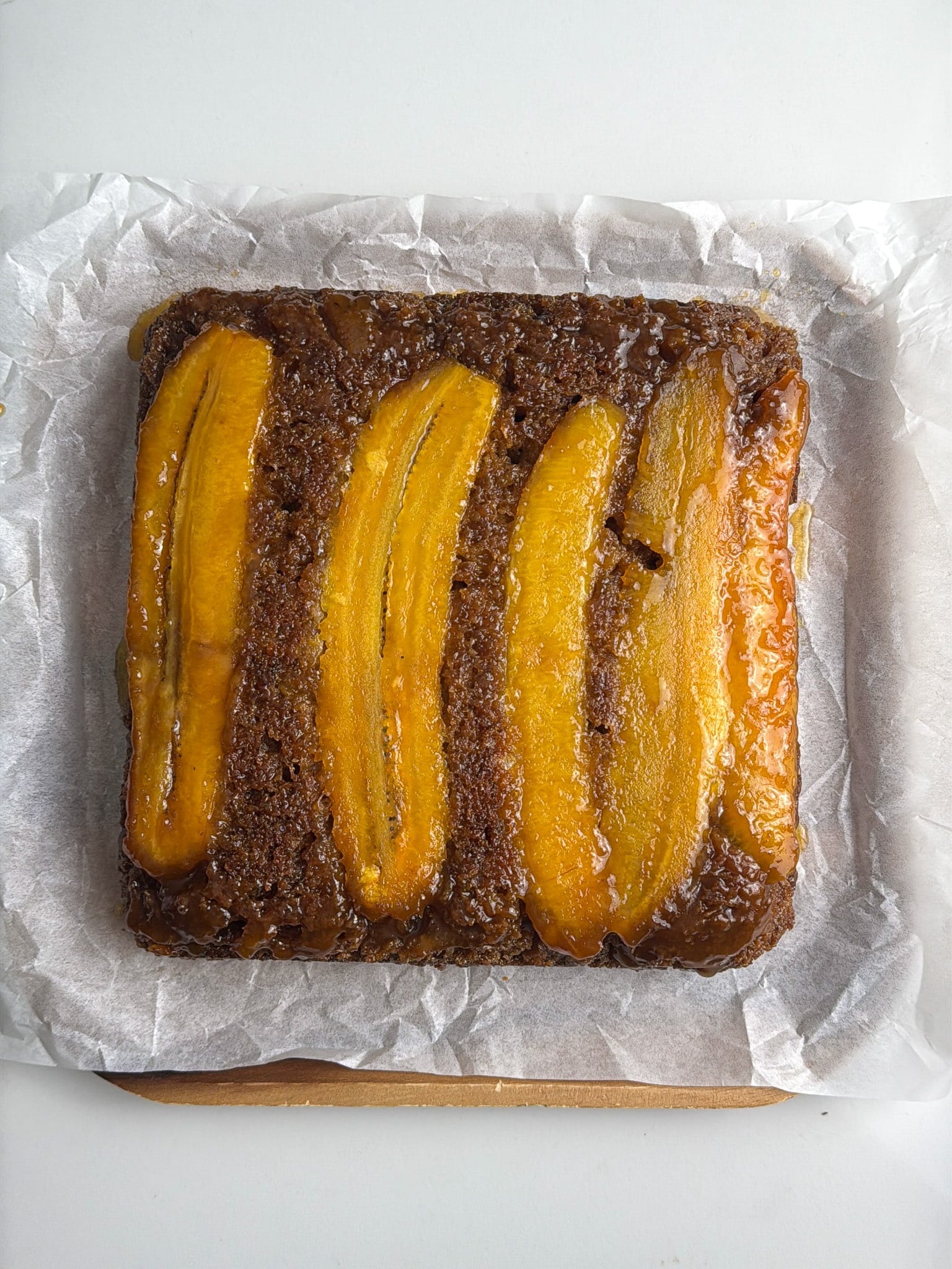 Baked upside-down plantain bread removed from the pan and ready to slice.