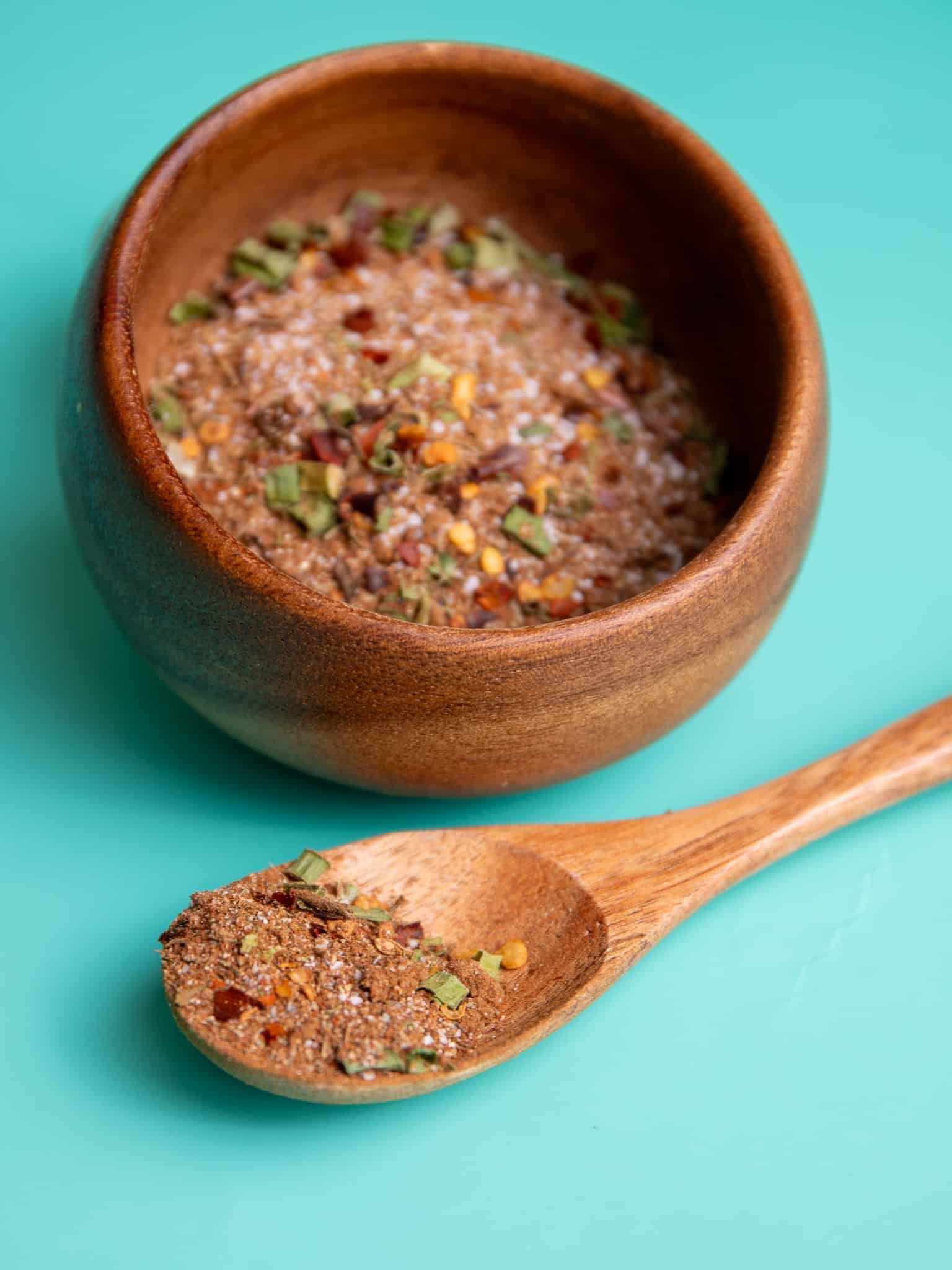 Jamaican jerk seasoning dry rub in a wooden bowl with spoon