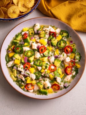 Shrimp ceviche with mango, avocado, jalapeños, and lime juice served with plantain chips