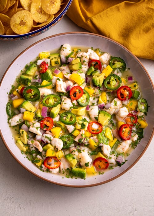 Shrimp ceviche with mango, avocado, jalapeños, and lime juice served with plantain chips