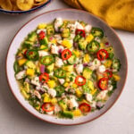 Shrimp ceviche with mango, avocado, jalapeños, and lime juice served with plantain chips